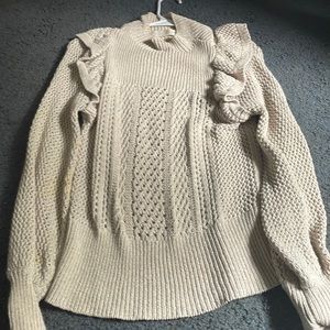 A sweater size small from happy nature